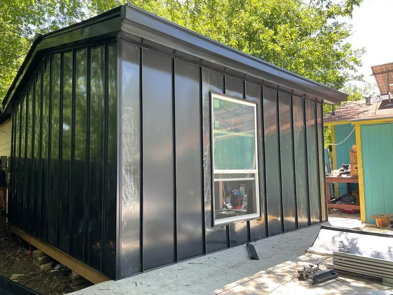 Black standing seam metal wall panels for Roof Inspection in Doctor Phillips